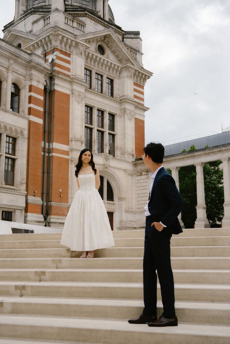 Couple on the steps of a red-brick museum