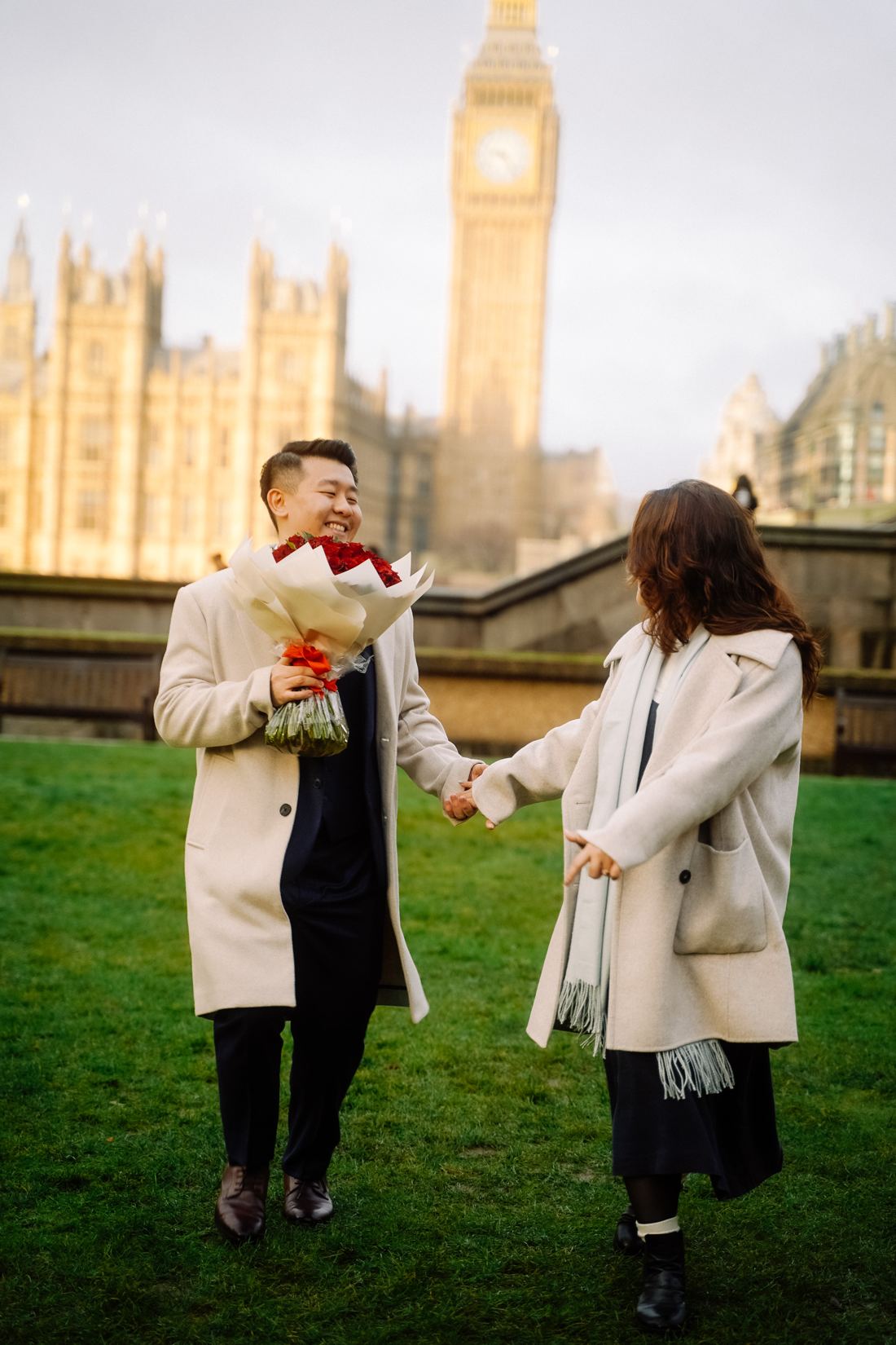 Couple laughing with a bouquet near Big Ben