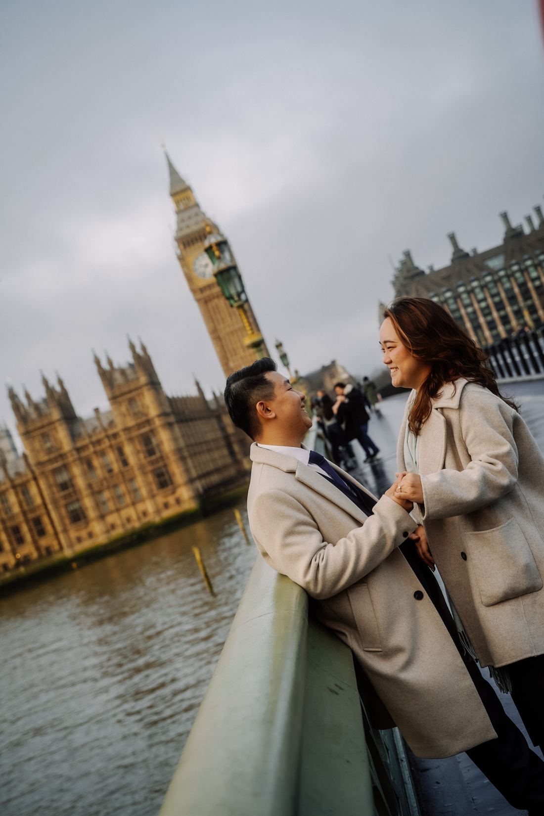 Couple laughing on Westminster Bridge