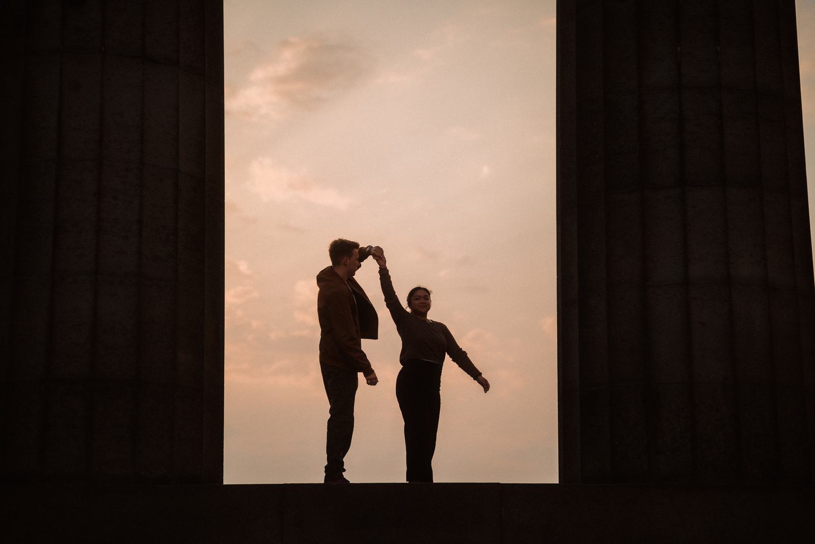 Couple dancing, silhouetted in a doorway