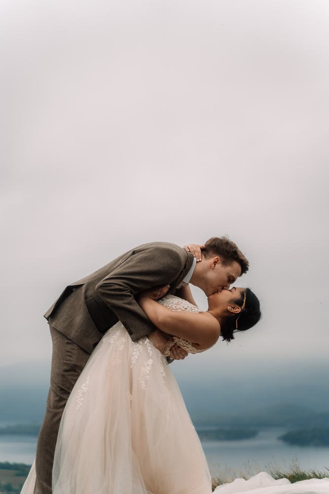 Groom dipping the bride for a kiss